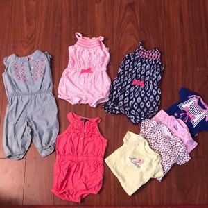 4 rompers and 4 onesies used gently.